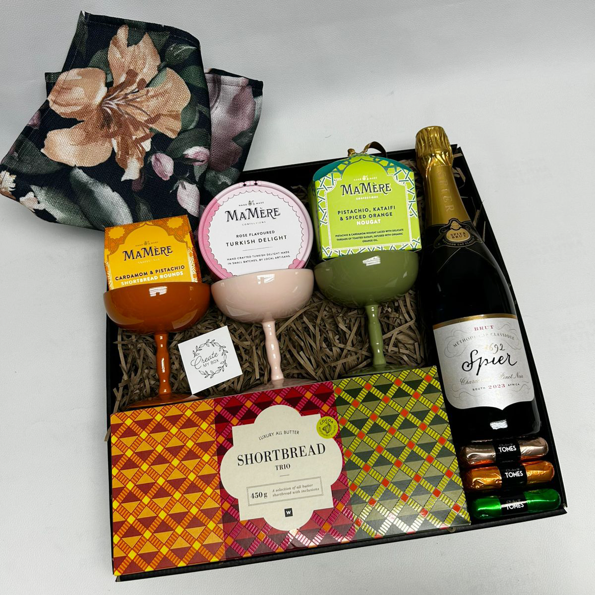 Celebration gift box with sparkling wine and gourmet treats